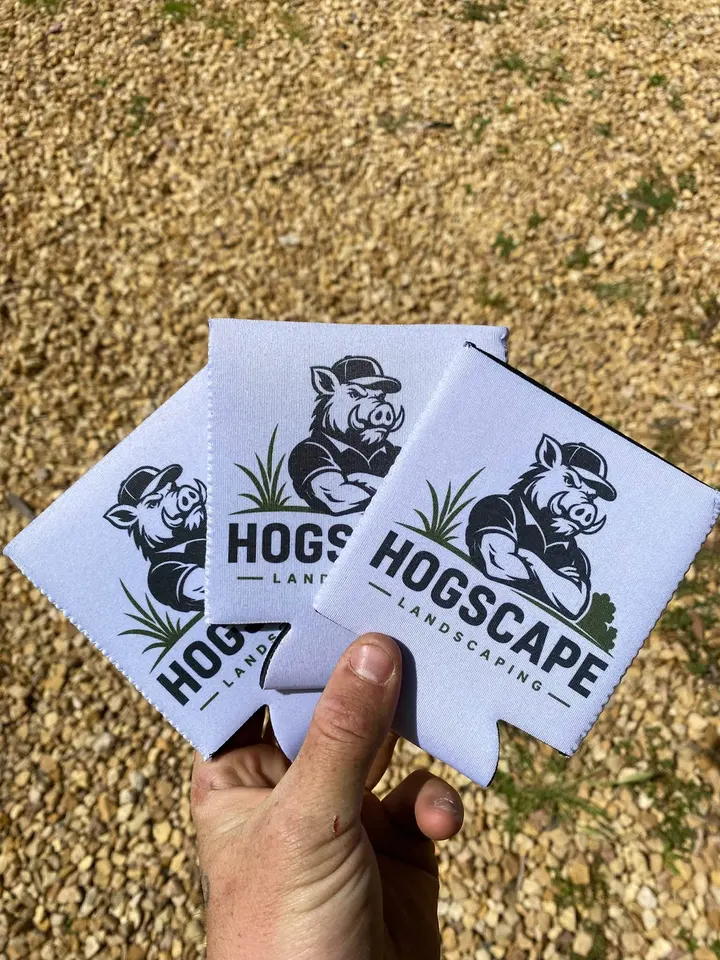 Three HogScape stubby holders held in a hand